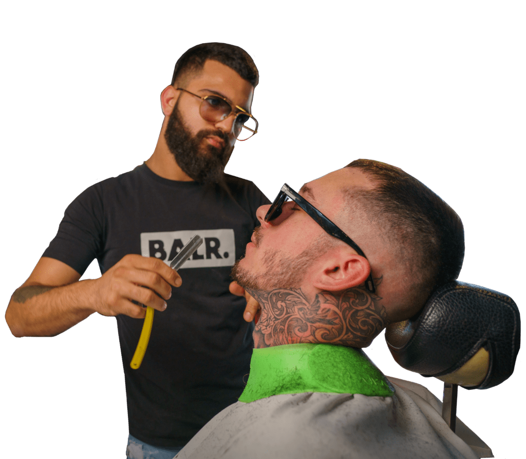 James barber shaving customer